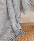 Close-up of gray tassel linen textured swag valances for farmhouse kitchen and small windows light filtering rustic topper