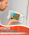 Tough As Nails Concrete Crack Sealant And Fast Cure Waterproof Patch Filler For Driveways And Garages With All Season Grey Caulk in use on a wall.