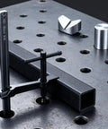 Heavy Duty Welding Fixture Set With T-Handle Clamps And 2 Fixtures Plus 12 Pins For 5/8 Inch Welding Tables, shown in use