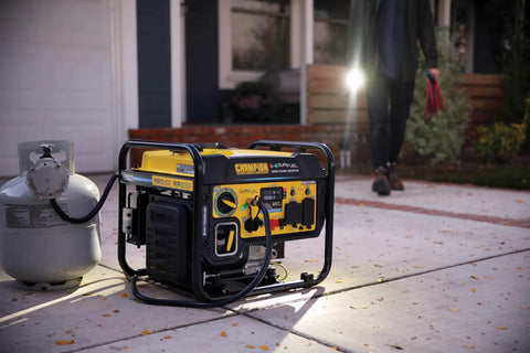 5500 Watt Dual Fuel RV Ready Portable Open Frame Inverter Generator With Quiet Technology next to propane tank on driveway