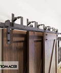 Black Rustic Triple Track Bypass Sliding Barn Door Hardware Kit for 1.375 to 1.75 inch doors installed, showing tracks and rollers.