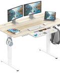 Electric Height Adjustable Standing Desk With Drawer And Memory Preset, Maple Finish, 55 by 28 Inches, with monitors and laptop