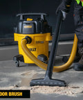 Worker using 5 Gallon Wet And Dry Shop Vacuum With StealthSonic Quiet Motor 4 HP Power Ultra Quiet Poly Vacuum With 6 Dust Bags