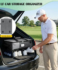 Man using Golf Trunk Organizer For Cars And Golf Bags with ventilated shoe compartment and water resistant PVC lining in SUV trunk.