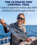 Person holding fish with Stainless Steel Fish Lip Grip With Ergonomic Handle And Spring Loaded Mechanism on a boat.