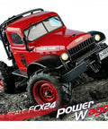 Badass One Twenty Four Scale Rc Crawler With Portal Axles And Two Speed Transmission Gnarly Off Road Rock Climbing Beast Ready To Run For Adults Full Send Crawling On Dirt Trails, red truck on rocky terrain.