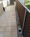 4 Inch Plastic Round Drainage Grate Cover No Fuss Debris Guard installed on patio walkway gutter