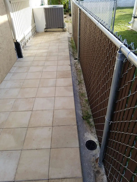 4 Inch Plastic Round Drainage Grate Cover No Fuss Debris Guard installed on patio walkway gutter