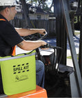 Worker on forklift with Fast Acting Grab-And-Go Spill Response Kit with water-resistant high-visibility yellow duffle tote.