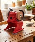 Badass Compact Mini Bench Grinder With 70mm Grinding Wheel 5500 RPM Speed Cordless 18V Lithium Battery compatible design in use sharpening a shovel.
