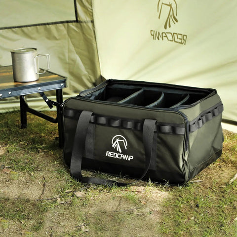 35L Tactical Camping Tote Organizer Duffel Bag with Dividers, Army Green, next to camping table and tent on grass