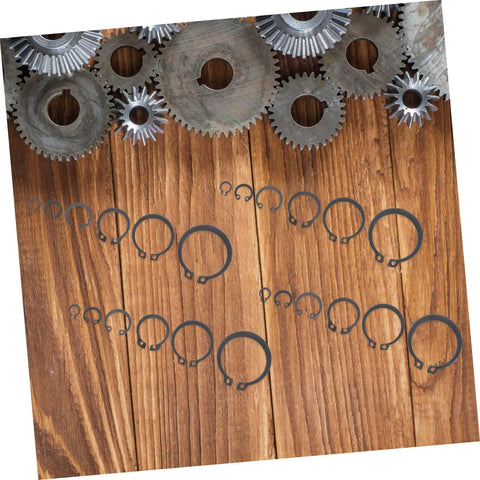 C Type Retaining External Snap Ring Kit in Carbon Steel Shaft Clips on wooden surface with metal gears