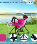 Child relaxing by a lake in a pink Kids Hammock Chair For Camping And Travel, Adjustable Folding Chair With Stand, portable and sturdy.