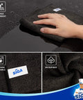 Hand using All Purpose Microfiber Cleaning Cloths Pack Of 12, Ultra Soft, Killer Streak Free And Scratch Free Rags, Absorbent Lint Free Towels For Windows, Kitchen, Cars, And More, 32 X 32 Cm, Black on surface
