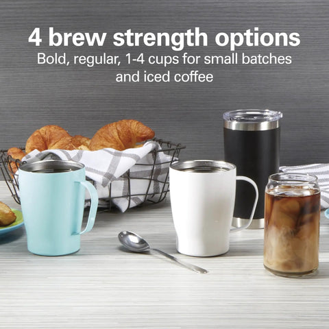 Table setting with blue, white, and black mugs, iced coffee, croissants, showcasing One Press Programmable Dispensing Drip Coffee Maker