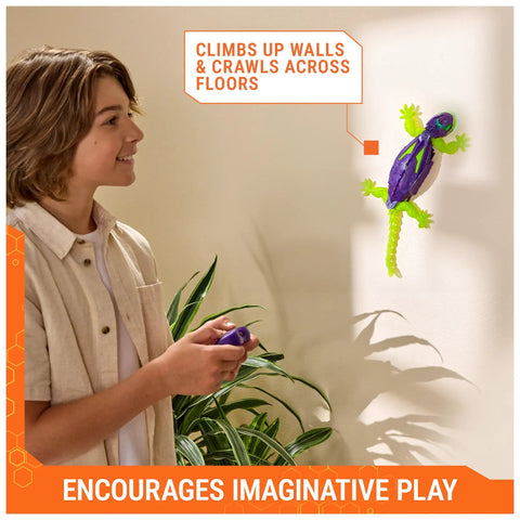 Child using remote with Rad Glow In The Dark Gecko Wall Climber Robot Toy on wall, showcasing realistic crawling action