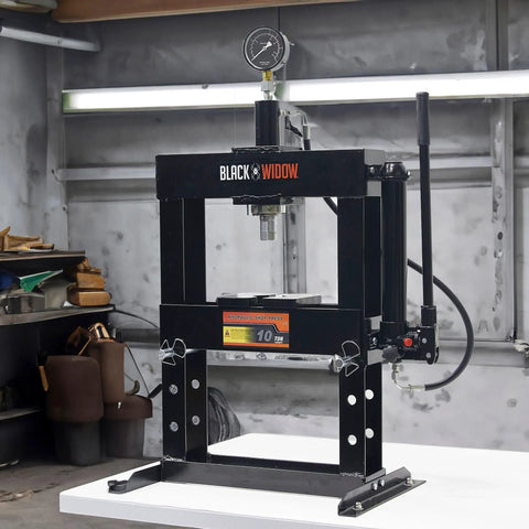 10 Ton Adjustable Benchtop Hydraulic Shop Press for Garage Use with pressure gauge and manual hand pump on workbench