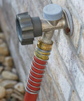 Heavy Duty Three Quarter Inch Water Hose 100 Foot, Workhorse Rubber and Vinyl connected to a faucet, kink-resistant red cover