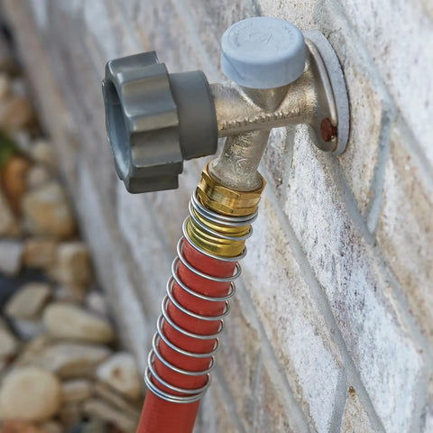 Heavy Duty Three Quarter Inch Water Hose 100 Foot, Workhorse Rubber and Vinyl connected to a faucet, kink-resistant red cover