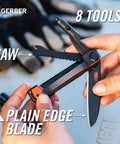 Person holding 8 In 1 EDC Multitool Pocket Knife With Blade Pry Bar Hammer Saw Bottle Opener And Two Sided Quarter Inch Bit Driver
