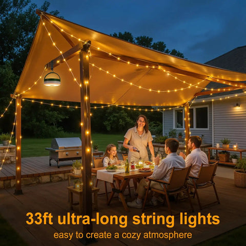 Family enjoying dinner under canopy with Solar Camping String Lights 33ft 100 LED With 9 Modes USB C Rechargeable Quick Storage.