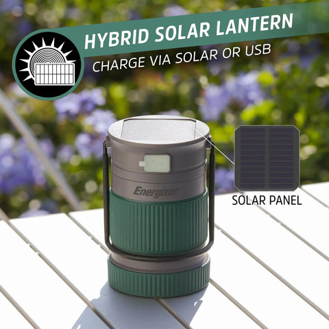 Hybrid Solar Lantern Go To Camping Buddy with USB or AA power on outdoor table with solar panel insert, IPX4 water resistant.