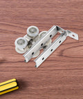Top Notch Two Piece Stainless Steel Barn Door Roller Hardware With Foolproof Wall Mounted Track And Heavy Duty Wheels, detailed view of rollers and rail.