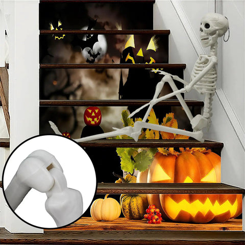 Halloween staircase with pumpkins, jack-o-lanterns, and skeleton decor