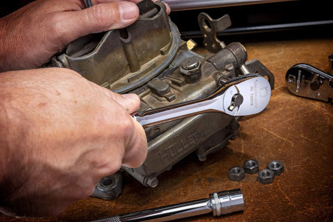 User using Three Eighth Inch Drive Ratchet And Drive Tools Set With Eighty Four Tooth Full Polish Chrome Ratchets on machinery