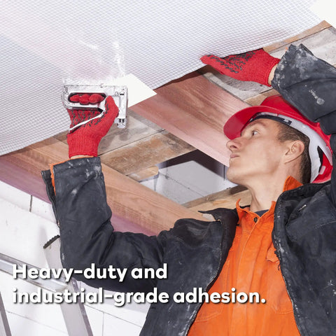 Construction worker using 9-Mil White Vapor Barrier Tape for encapsulation and sealing with silicone adhesive.