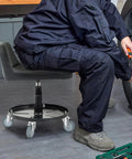 Mechanic using stool with 3 Inch Swivel Stem Caster Wheels Set Of Four Heavy Duty Seven Sixteenth Inch Stem Diameter TPR Rubber