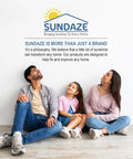 Family of three sitting on the floor smiling, engaging with the brand message for home improvement at Sundaze.