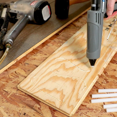Applying Full Size 4 Inch Hot Glue Sticks 200 Count Multi Temp For High And Low Temp Glue Guns Beefy Bond on wood surface