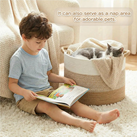 Child sitting next to 70L Cotton Rope Basket For Living Room And Nursery, Boho Woven Toy Box, Kid Safe, with cat resting inside