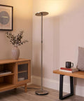 Super Bright LED Floor Lamp Torchiere for Living Room and Office with brushed nickel finish next to wooden cabinet and books