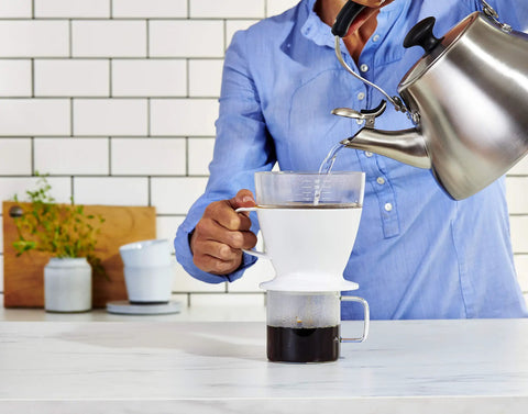 Single Serve Pour Over Coffee Maker With Auto Drip Tank For A Balanced Brew in use on kitchen counter with kettle pouring water