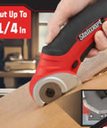 Stalwart Cordless Electric Scissors In Vibrant Red cutting cardboard with precision, designed for DIY and craft projects.