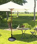 Heavy Duty Cast Iron Umbrella Base For Patio And Garden, 43lb Round Market Stand With Classic Bronze Finish on lawn