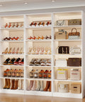 18 Tier Tall Shoe Cabinet Wooden Shoe Rack White Narrow Shoe Storage Organizer With Removable Shelves For Small Spaces Shoe Shelf Tower holds various shoes and bags organized on shelves.