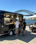 Heavy Duty Turnkey Commercial Grade Black Taco Food Truck And Slick Mobile Catering Trailer With Private Restroom And Dot Certified Build For Operations in use by customers.