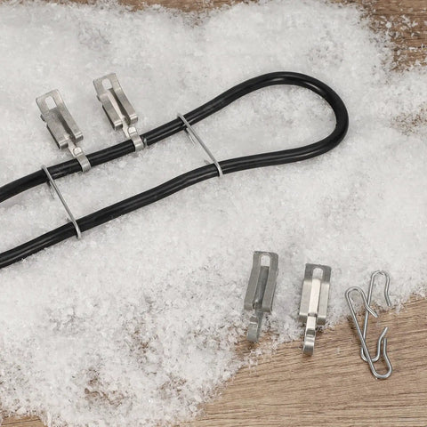 Rugged Aluminum Roof And Gutter Deicing Cable Clips And Spacers Kit with cables, clips, and spacers on snowy surface.