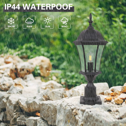 Outdoor Post Light Fixture With Pier Mount, 20-Inch High Matte Black Lantern With Clear Seeded Glass in rain on rocky path