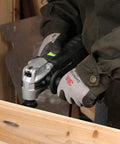 Person using Heavy Duty Pro Grade Oscillating Multi Tool Kit With 6 Variable Speeds 3.5A for cutting wood