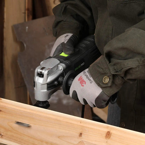 Person using Heavy Duty Pro Grade Oscillating Multi Tool Kit With 6 Variable Speeds 3.5A for cutting wood