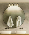 Norwood 4-Light Traditional Bath Fixture Wall Lamp in Bronze Finish over bathroom mirror and sinks