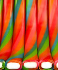 Ropes Candy Twisted Rainbow Punch Flavor Soft And Chewy 9 Oz Pack, colorful fruit ropes with tart filling, close-up view.