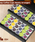 4 Tier Coffee Syrup Rack Organizer With Room For 8 Syrup Bottles And 84 Coffee Pods Perfect Countertop Bar Station For Your Coffee Setup Kitchen Storage Black, showing two open drawers filled with coffee pods.