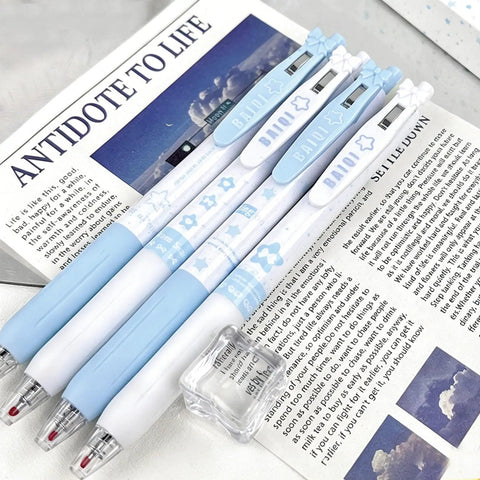 Four Pack Cute Retractable Gel Pens Blue Star 0.5mm Fine Point Black Ink with star patterns on open magazine