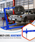 Heavy Duty Hydraulic Engine Hoist With 4400 Lb Capacity Telescoping Boom Folding Cherry Picker Shop Crane in a workshop lifting a car.