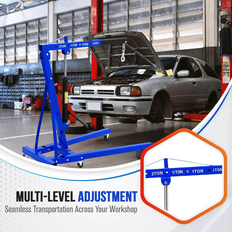 Badass 2 Ton Hydraulic Engine Hoist With Telescopic Boom and Six Heavy Duty Swivel Casters for Easy Motor Swaps in a garage.